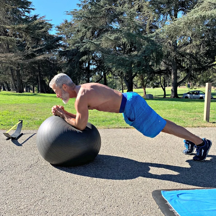ball plank on elbows