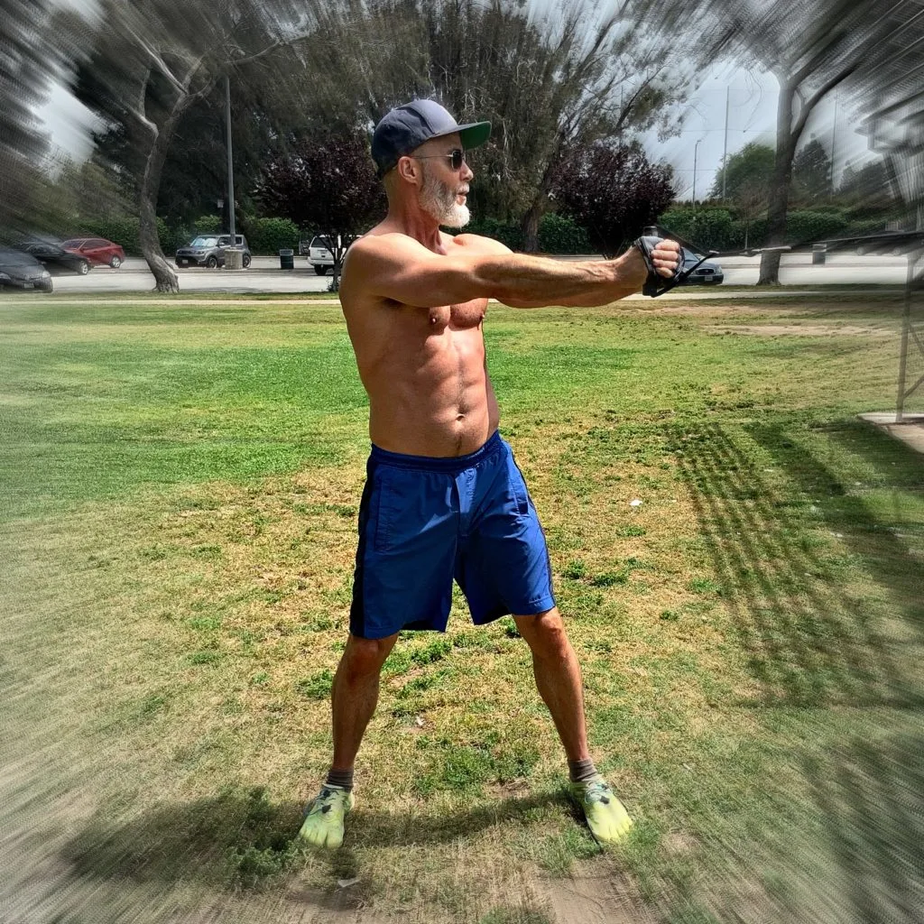 53 year-old athlete training in park.