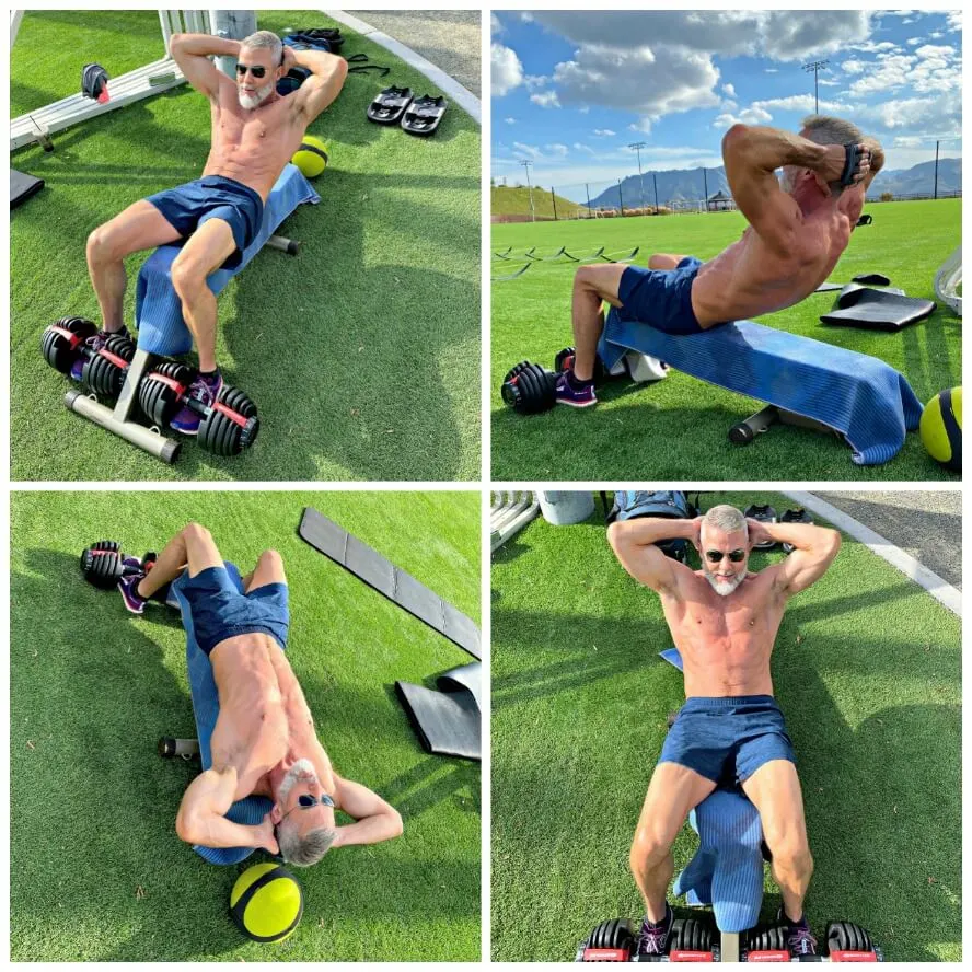 54-year old athlete trains abdominals outdoors to warm-up for leg day.