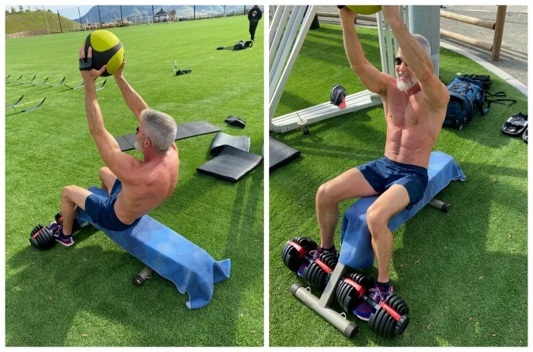 Man doing crunches with medicine ball.