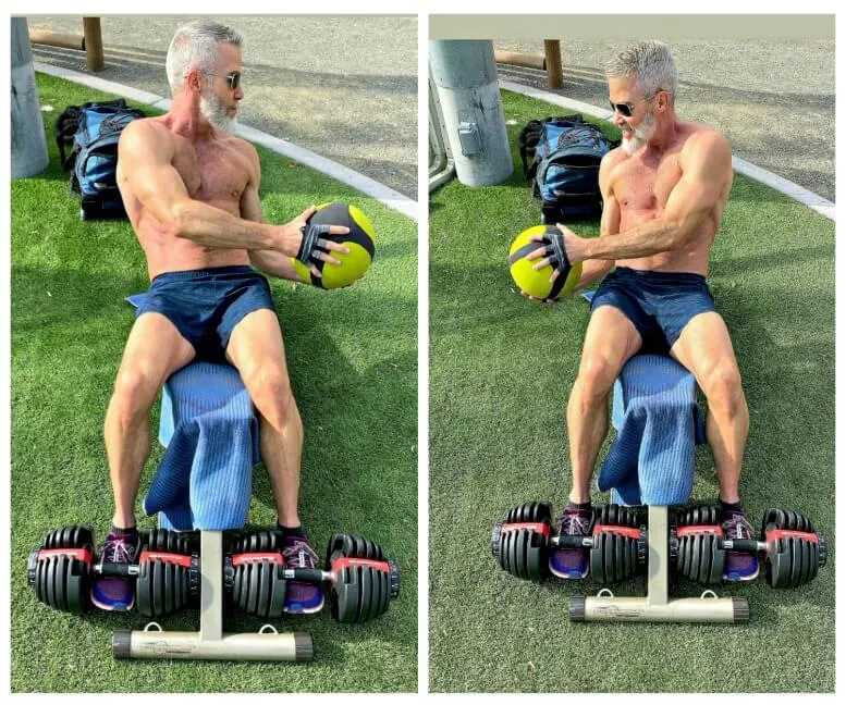 54-year old man trains abdominals with medicine ball.