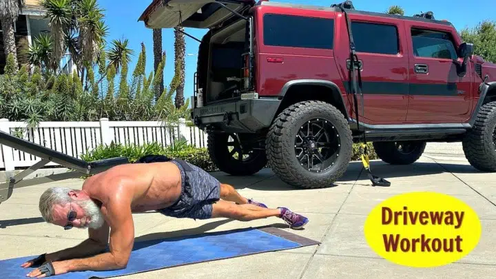 Mature athlete fitness training in his driveway.