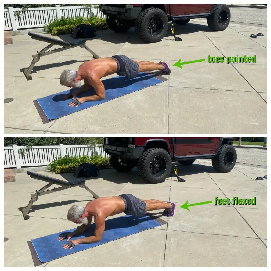 Man does variation on plank exercise during driveway training workout.