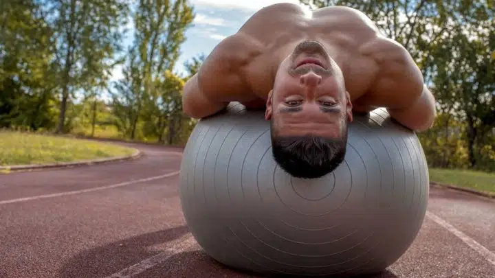 fit man exercises on stability ball
