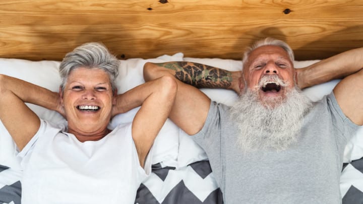 healthy mature couple putting positive feelings out into the universe