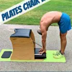 mature athlete doing pilates chair workout at park