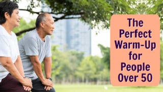 mature, fit asian couple warm-up at park