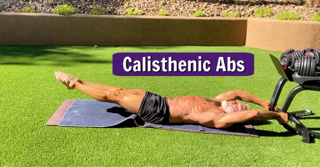 mature athlete does calisthenic abs outdoors
