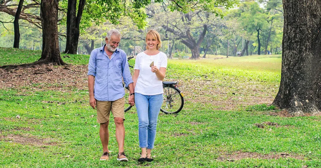 aging couple enjoying outdoors after improving health of their bones