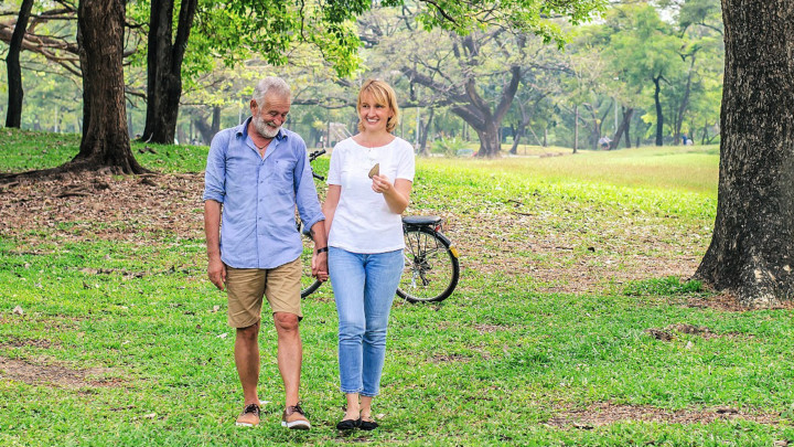 aging couple enjoying outdoors after improving health of their bones