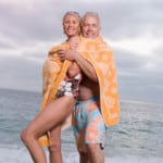 fit mature couple on beach feeling great from anti-aging fasting