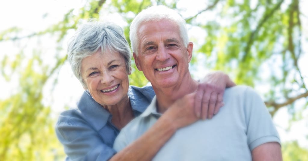 healthy senior couple experience increased happiness through anti-aging and healthier aging therapies while growing old