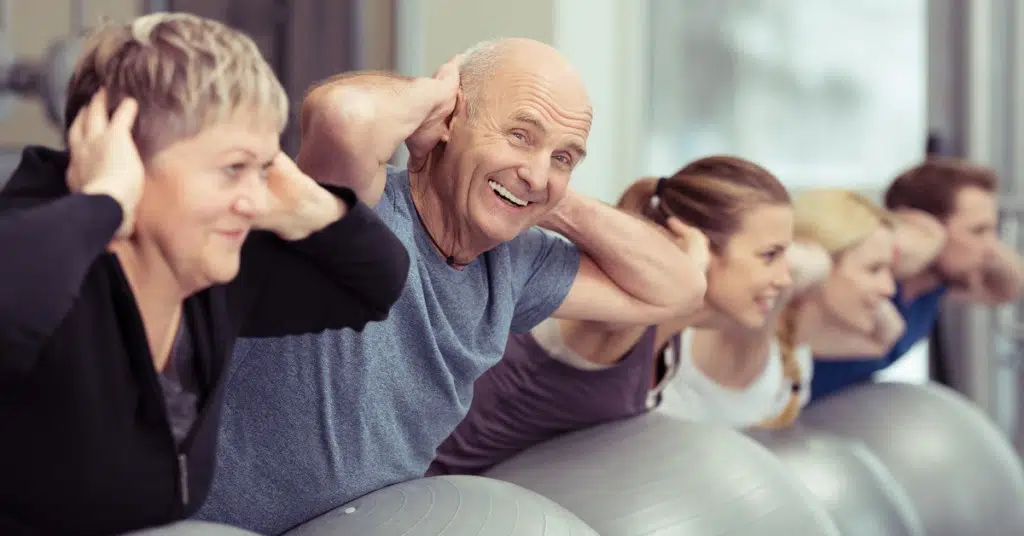 senior man develops spine health with lower back and neck strengthening exercises