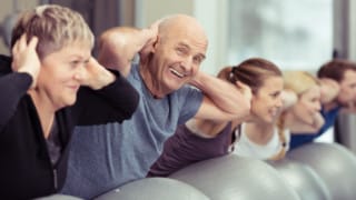 senior man develops spine health with lower back and neck strengthening exercises