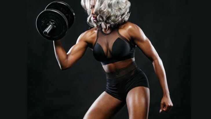 flourishing woman over 40 flexing and embodying the new definition of well-being