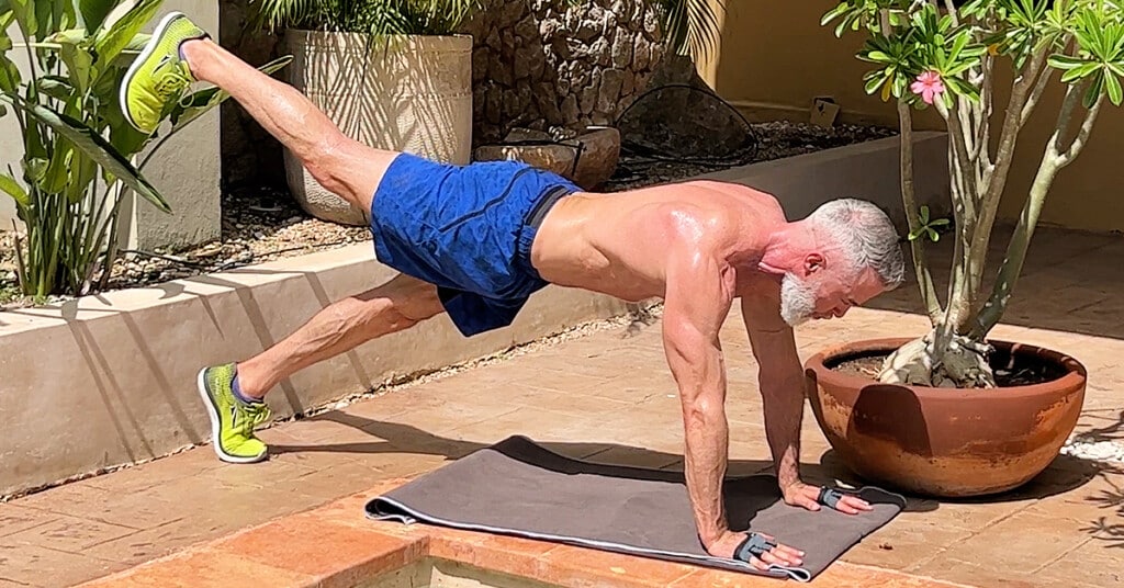 mature man tries strength training exercises for beginners