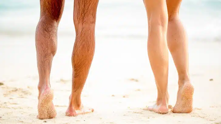 couple at beach having tightened the skin on their legs after 50