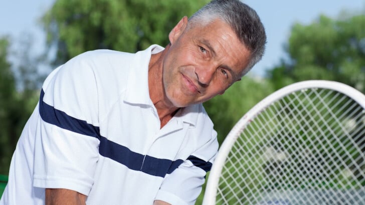 healthier man living fulfilling life during outdoors tennis and avoiding indulgence